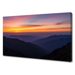 Vibrant sunset paints the sky above a range of silhouetted mountains, creating a breathtaking panoramic view.