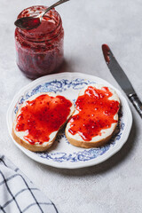 Sandwich with butter and raspberry jam