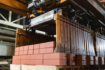 Automated conveyor system for brick drying and packaging in manufacturing plant