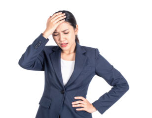 A woman in a navy blue suit shows signs of stress or headache, holding her forehead with one hand and her waist with the other, expressing discomfort or frustration.