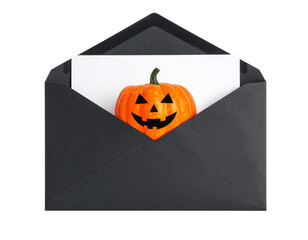 A black envelope contains a white card featuring a smiling Jack-o'-lantern pumpkin with triangular eyes and nose.