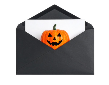 A black envelope contains a white card featuring a smiling Jack-o'-lantern pumpkin with triangular eyes and nose.