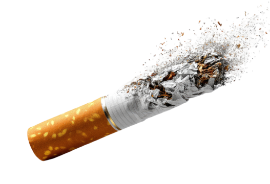 A used cigarette, remnants of smoke and ash dispersing