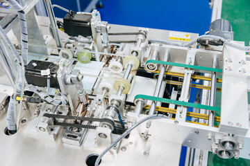 Face mask factory, Surgical mask plant production line, Closeup machine conveyor belt roller in...