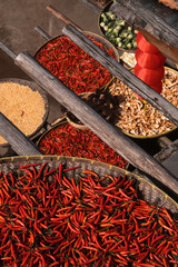 Harvest season celebration in a rural Chinese village with traditional architecture at sunset