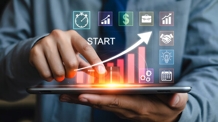 Businessman uses digital tablet to analyze growing business statistics and financial growth charts with startup concept