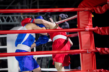 Boxing round in a fight between two sportsmen in the ring