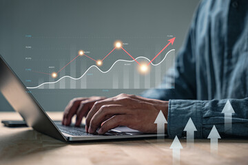 Data market growth strategy research plan for a business man using laptop, typing investment data,...