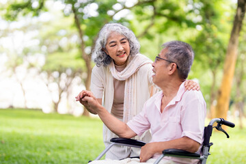 Senior, couple and people with disability in park for fresh air, walking and enjoyment of...