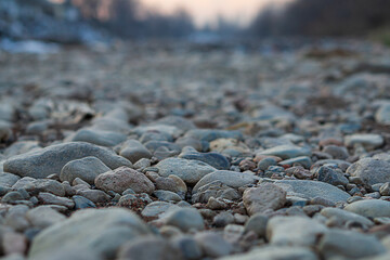 Close-up of natural landscape, multi-faceted view of dry river with waterless bottom. Changes in state of natural objects as result of influence of large corporations in order to obtain huge profits