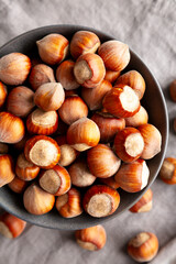 Organic Raw Hazelnuts in a Bowl, top view. Close-up.