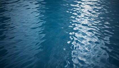 Obraz premium The image captures a serene display of water's surface, with delicate ripples and reflective light.