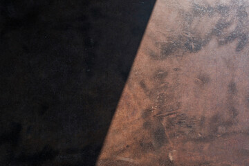 red rusty surface steel plate wallpaper in sunshine with dark shadow shade at left side
