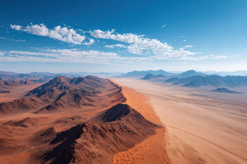 Fototapeta premium breathtaking aerial view captures serene beauty of remote desert landscapes and sweeping dunes