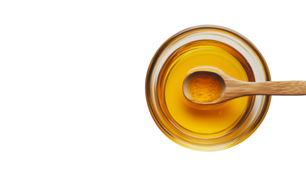 Golden honey in a glass bowl with a wooden spoon, created with AI, PNG