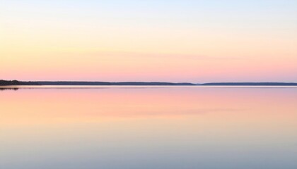 Obraz premium Pastel Sunset Reflected on Calm Lake with Minimalist Horizon 