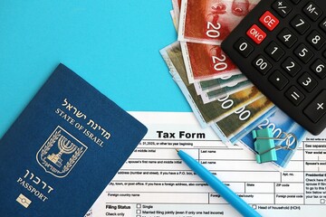 Israel new shekels money with passport and tax form on flag. The current Israel money and blank