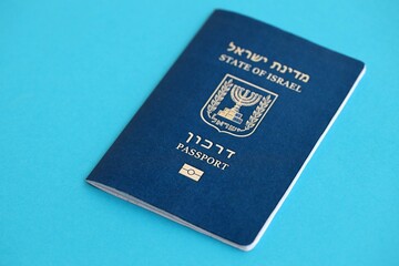 Israel passport on blue. The current Israel biometrical pass lies on blue background