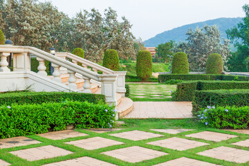 Walkway pathway s curve in public park,Lawn with curved paved garden path,Garden landscape design in flower garden,Selective focus,copy space.