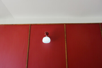 Modern lamp on red wall for home decor,Interior design of dining room or living room.