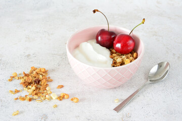Breakfast Bowl with Yogurt, Granola and garden Cherries copy space