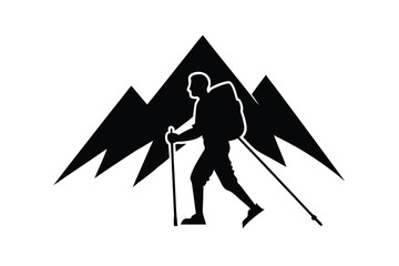 Fototapeta premium Silhouette of a hiker with trekking poles against jagged mountain peaks