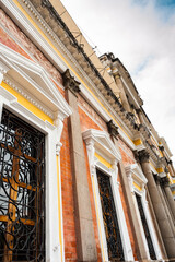 Historic facade with columns and architectural details in Xela 