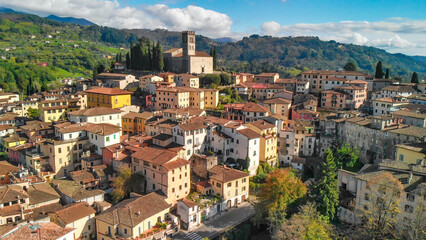Fototapeta premium Aerial view of Barga, Garfagnana, showcasing the picturesque Italian village on a sunny day