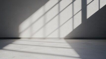 Obraz premium A minimalist white room with a gray floor and a window.