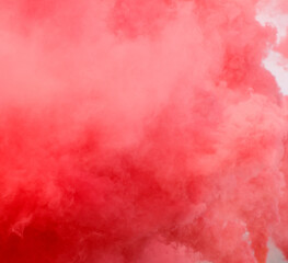 A red cloud of smoke with a pinkish hue