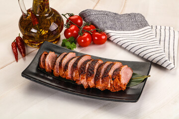 Sliced duck breast baked with cherry