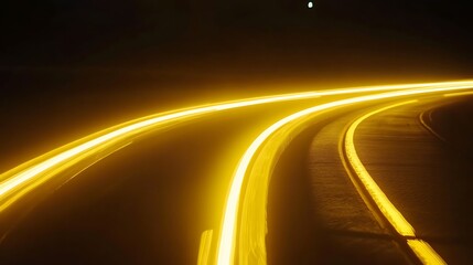 Yellow light trails on a curved road at night