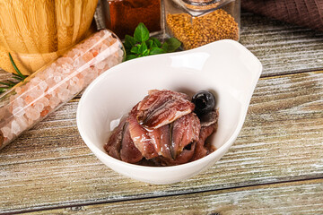 Canned anchovy with oil in the bowl