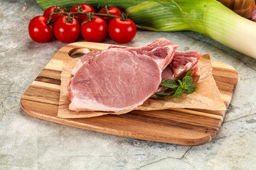 Raw pork steak loin with bone