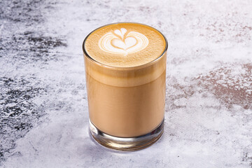 Hot cappuccino beverage in the glass