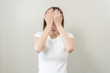 Dizzy asian young woman, girl headache or migraine pain suffering from vertigo or sick, holding head with hand, health problem of brain or inner ear not balance, standing isolated on white background.