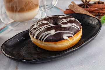 Delicous sweet donut with chocolate glaze