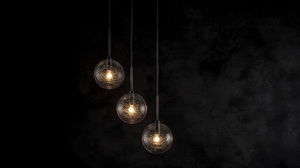 Three hanging pendant lights with a black metal frame and a textured glass shade.