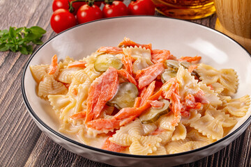 Italian pasta farfalle with salmon