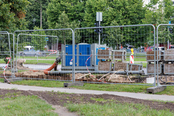 Title: Urban Construction Site with Blue Generator
