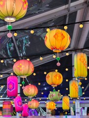 Close-up of Varied Hanging Colorful Lanterns Indoors