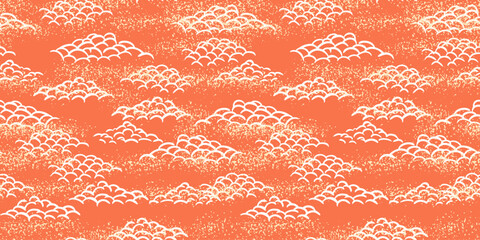 Seamless vector pattern with stylized hand drawn clouds in an Asian inspired design. White curved line clouds on a warm orange background with a subtle textured effect. Ideal for textiles, prints