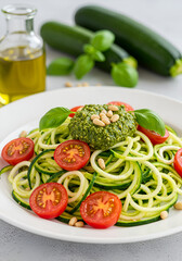 Zucchini noodles with pesto and cherry tomatoes