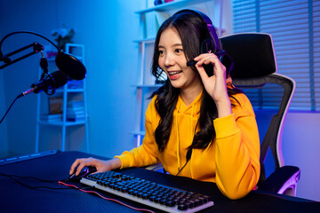 Asian beautiful esport woman gamer play online video game on computer. 