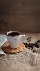 cup of coffee on a simple background, cozy home, notebook and coffee, coffee beans, flatlay, background