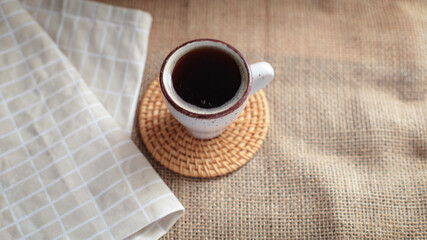 cup of coffee on a simple background, cozy home, notebook and coffee, coffee beans, flatlay, background