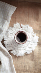 cup of coffee on a simple background, cozy home, notebook and coffee, coffee beans, flatlay,...