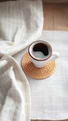 cup of coffee on a simple background, cozy home, notebook and coffee, coffee beans, flatlay, background
