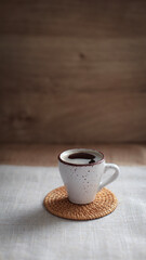 cup of coffee on a simple background, cozy home, notebook and coffee, coffee beans, flatlay, background