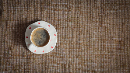 cup of coffee on a simple background, cozy home, notebook and coffee, coffee beans, flatlay, background